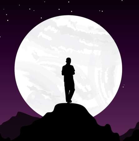 man standing in front of the moon